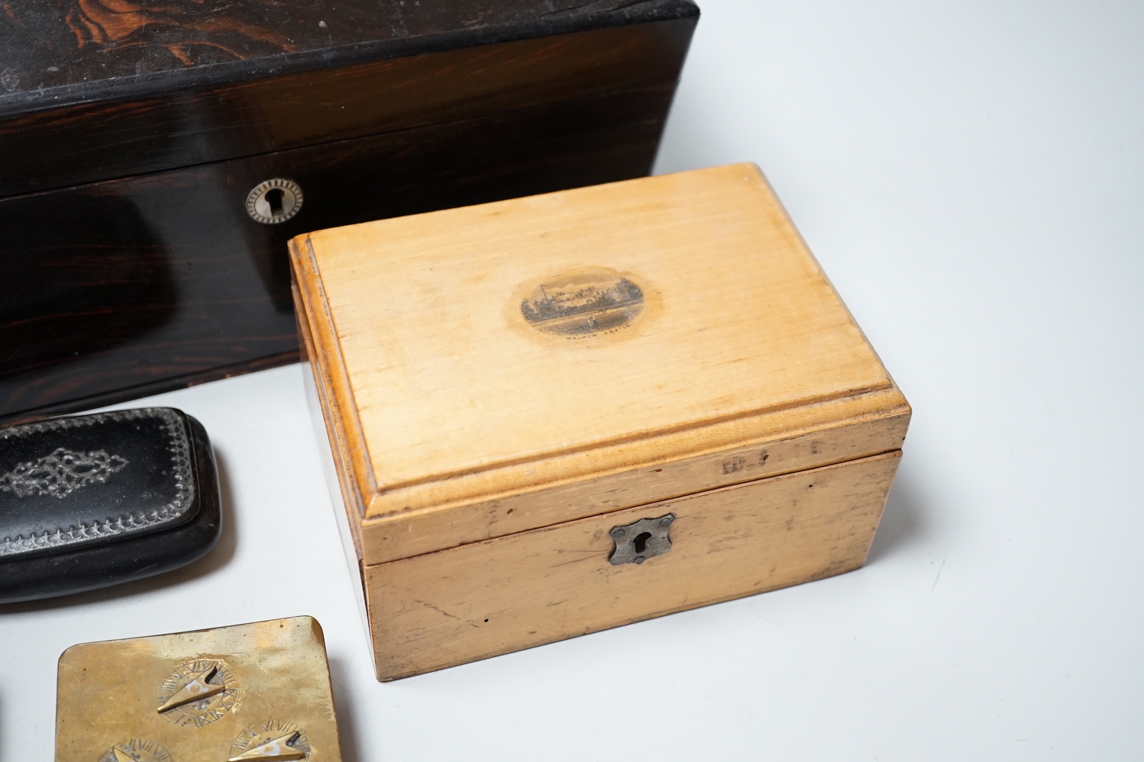 A Victorian Coromandel box containing a Victorian tortoiseshell mother-of-pearl inlaid card case, a Mauchline ware box and other boxes